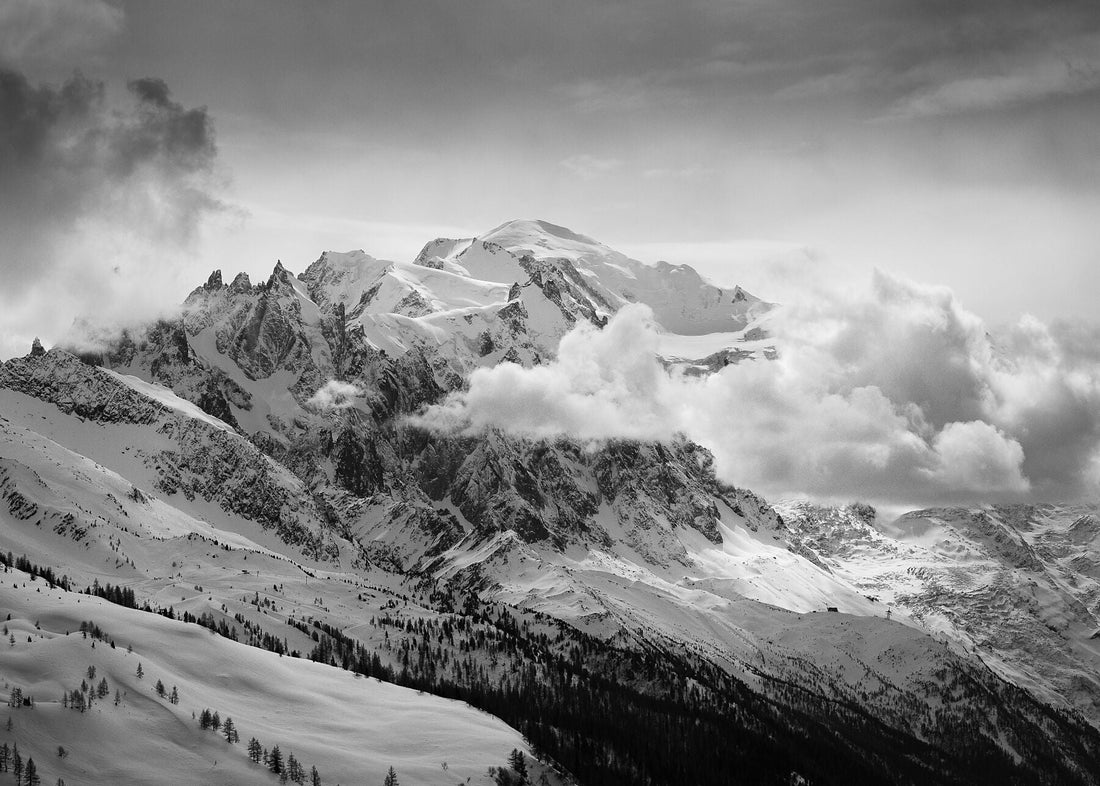 Mont blanc high above clouds and the Chamonix valley floor