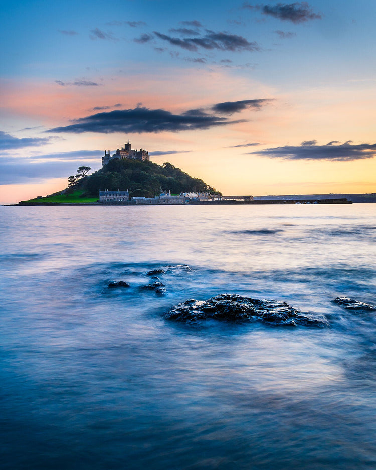 St Michaels mount at sunset with a calm sea