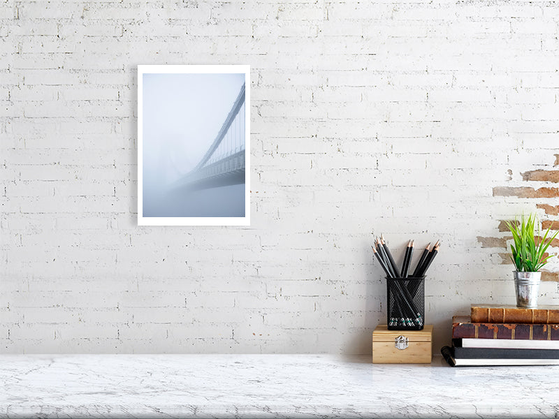 Print of Clifton Suspension Bridge in Bristol just visible through thick fog pictured on a brick wall