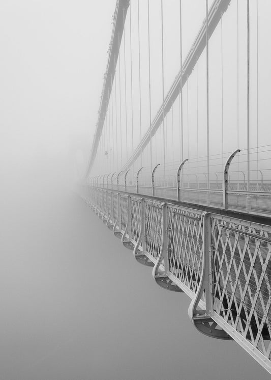stunning black and white photograph captures the haunting beauty of one of the UK's most iconic landmarks, as it emerges mysteriously from a blanket of fog