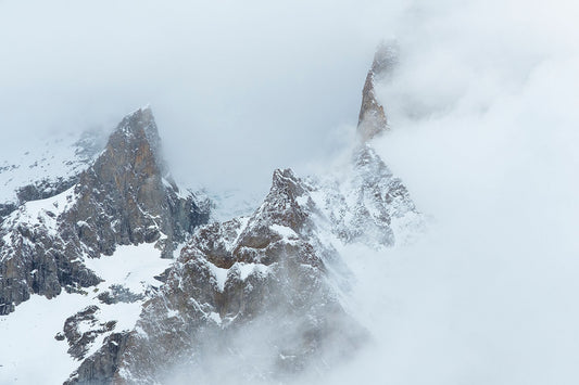 High cloud obscures a mountain peak in the Mont Blanc Massif above Courmayeur