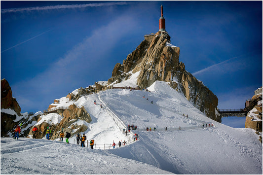 Like ants on the hillside, skiers the Aiguille du Midi make the precarious way to start the classic descent of the Vallee Blanche.