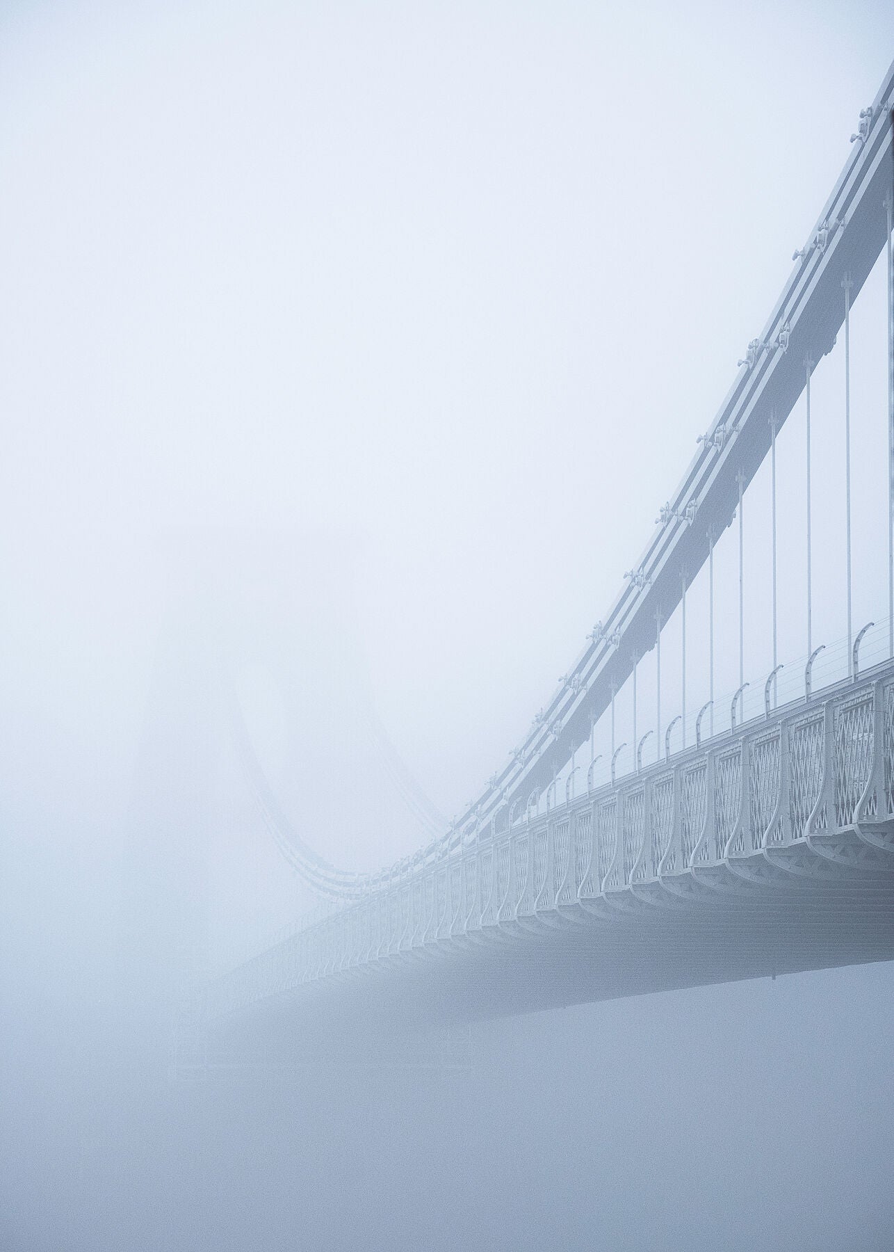Clifton Suspension Bridge in Bristol just visible through thick fog