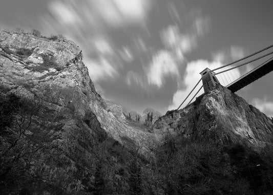 Black and white image of Clifton Suspension Bridge and the Avon Gorge in Bristol from the Portway below