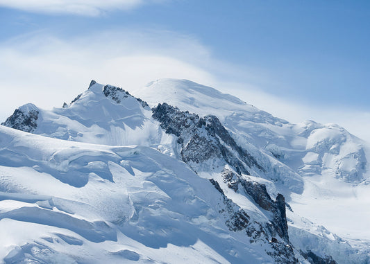 Cloud blows across the summit of Mont Blanc, seen from the Aiguille du Midi in the Mont Blanc Massif