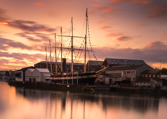 The SS Great Britain in a golden sunrise over Bristol harbour