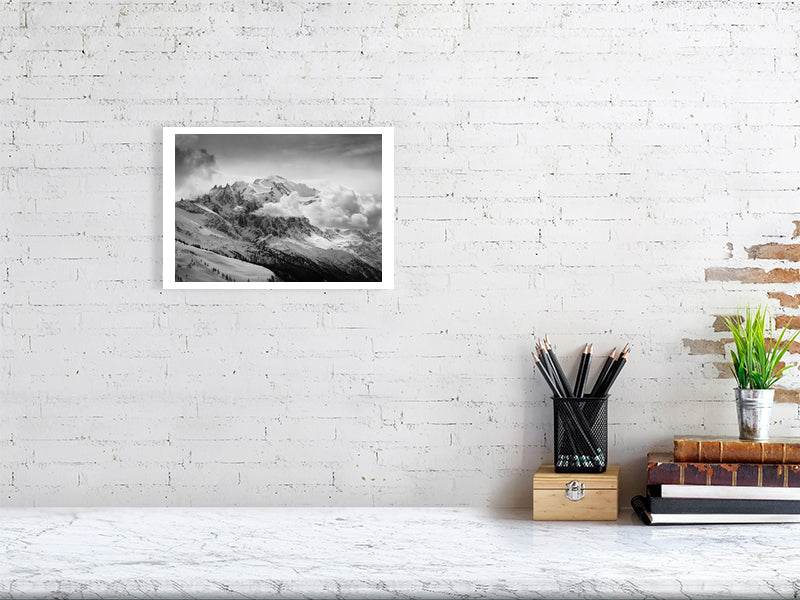 Black and white print of the Mont Blanc Massif against a brick wall