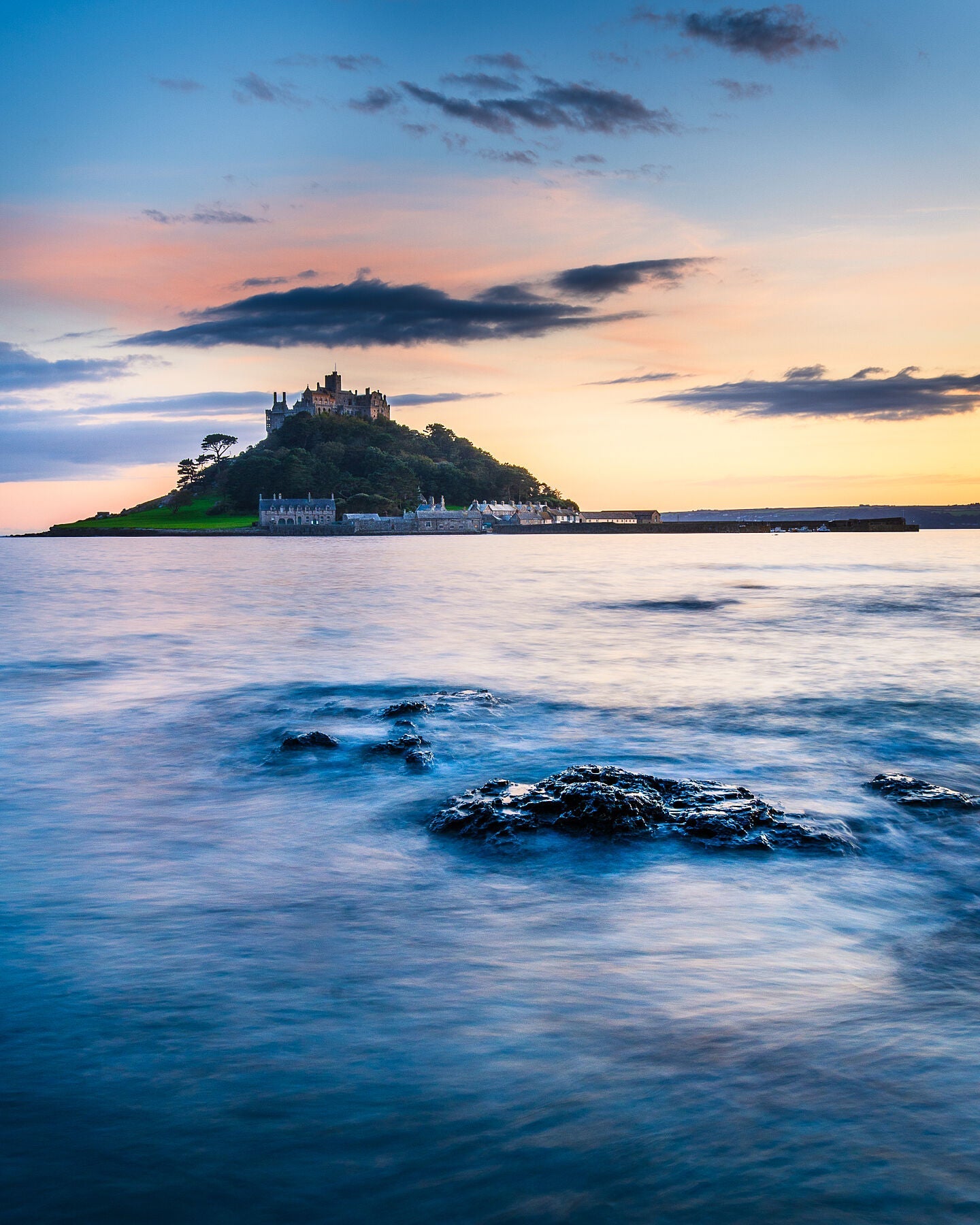 St Michaels mount at sunset with a calm sea