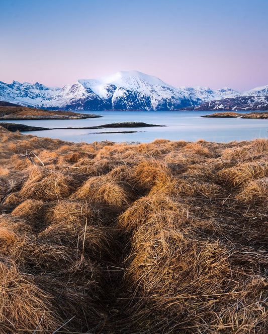 Snow Covers Mountains at Sunset, Norway