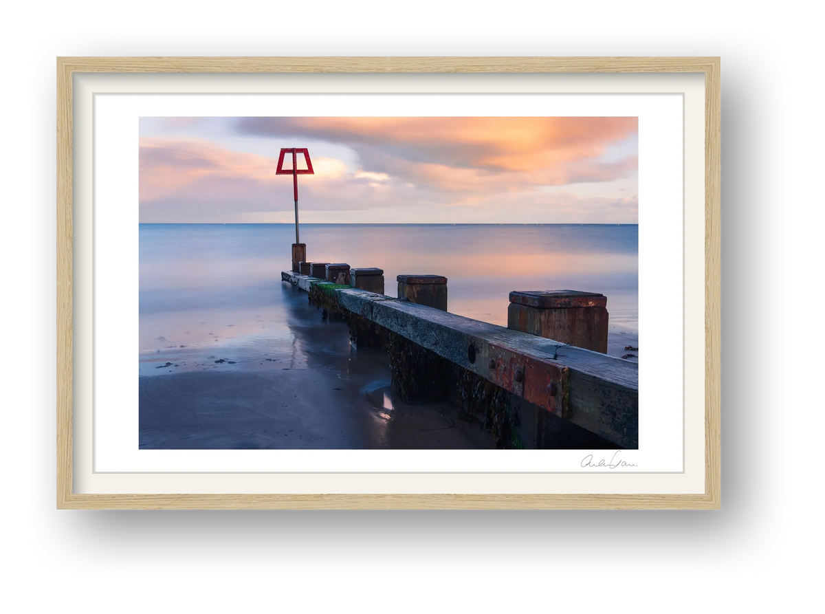 Coastal Groin at Sunset — framed